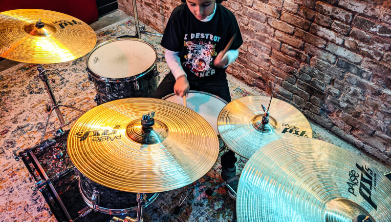 School of Rock Student Playing the Drums
