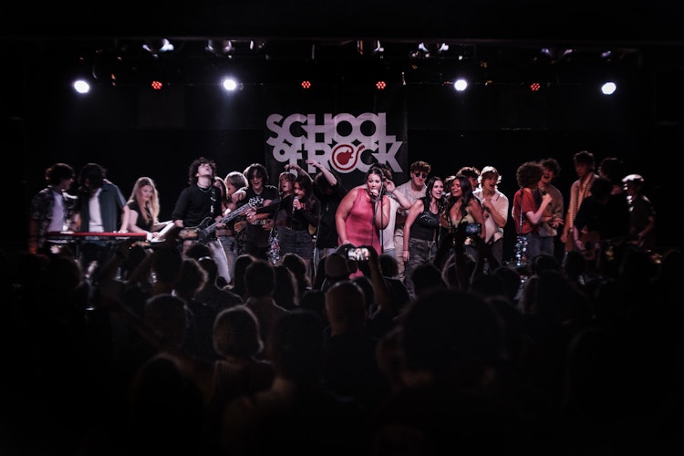 School of Rock Students Performing on Stage