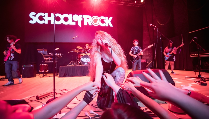 School of Rock Student Performing on Stage